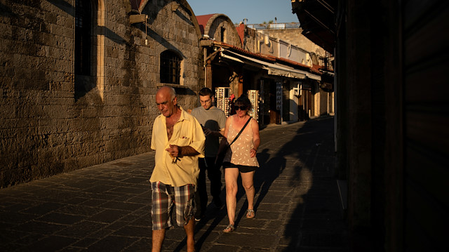 People make their way in the Old Town of Rhodes, following the coronavirus disease (COVID-19) outbreak, on the island of Rhodes, Greece, June 30, 2020. Picture taken June 30, 2020. REUTERS/Alkis Konstantinidis
