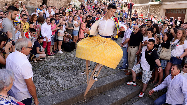 A skirt wearing dancer on stilts performs the whirling Dance of the Zancos on Saint Mary Magdalene's feast day in Anguiano, Spain, July 22, 2018. REUTERS/Vincent West

