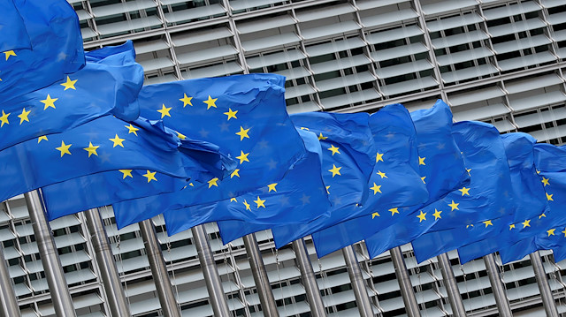 European Union flags flutter outside the European Commission headquarters