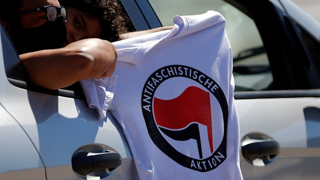 Protesters show an Antifa t-shirt during a demonstration