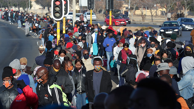 File photo: Stranded commuters wait for transportation at a bus terminal during a protest by taxi operators over the government's financial relief for the taxi industry, amid the coronavirus disease (COVID-19) lockdown, in Soweto, South Africa, June 22, 2020