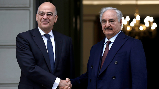 Greek Foreign Minister Nikos Dendias welcomes Libyan commander Khalifa Haftar