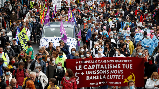 French health workers hold a banner during a protest in Nantes as part of a nationwide day of actions to urge the French government to improve wages and invest in public hospitals, in the wake of the the coronavirus disease (COVID-19) crisis in France June 16, 2020. The slogan reads " Capitalism kills, let's unite in the struggle". REUTERS/Stephane Mahe

