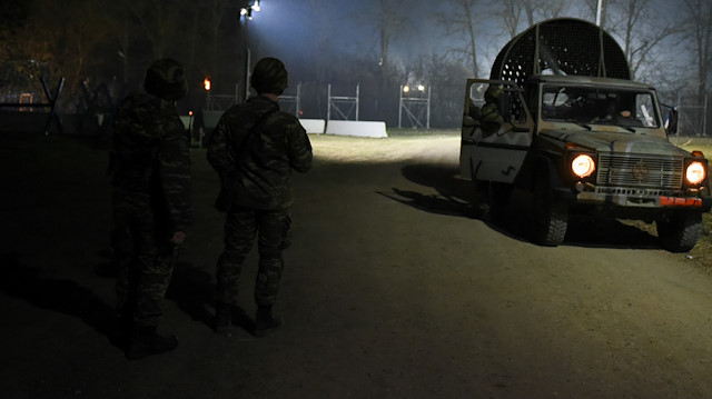 Greek soldiers stand guard