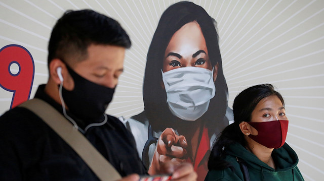 FILE PHOTO: People are seen wearing protective face masks at a Sudirman train station amid the coronavirus disease (COVID-19) outbreak in Jakarta, Indonesia, June 8, 2020. 