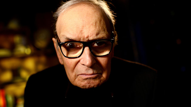 FILE PHOTO: Italian composer Ennio Morricone, poses for a portrait during an interview with Reuters before performing on stage at the O2 Arena in London, Britain February 16, 2016. REUTERS/Dylan Martinez/File Photo  