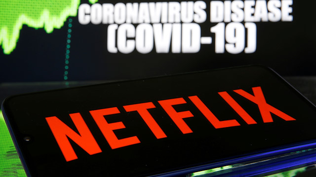 FILE PHOTO: Netflix logo is seen in front of diplayed coronavirus disease (COVID-19) in this illustration taken March 19, 2020. REUTERS/Dado Ruvic/Illustration/File Photo

