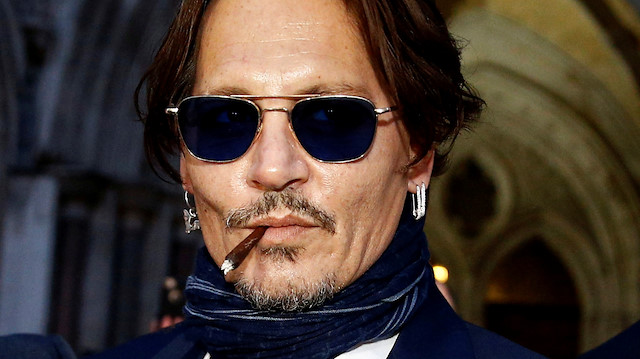 FILE PHOTO - Actor Johnny Depp leaves the High Court in London, Britain, February 26, 2020. REUTERS/Henry Nicholls/File Photo

