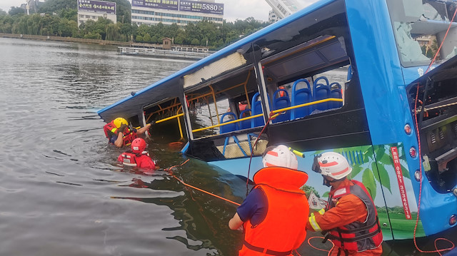 Rescue workers are seen at the site where a bus carrying students plunged into a reservoir, in Anshun, Guizhou province, China July 7, 2020.