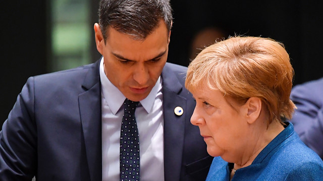 File photo: German Chancellor Angela Merkel and Spain's Pedro Sanchez 