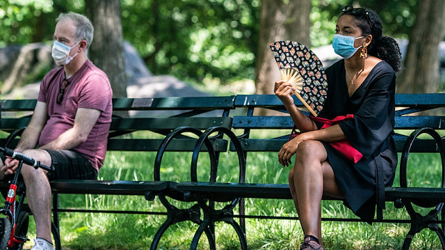 People enjoy the weather in Central Park, the day before the city starts phase two of reopening after the lockdown due to the coronavirus disease (COVID-19), in the Manhattan borough of New York City, U.S., June 21, 2020. REUTERS/Jeenah Moon  