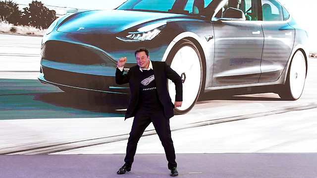 FILE PHOTO: Tesla Inc CEO Elon Musk dances onstage during a delivery event for Tesla China-made Model 3 cars in Shanghai, China January 7, 2020. 