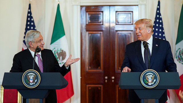 FILE PHOTO: Mexico's President Andres Manuel Lopez Obrador and U.S. President Donald Trump make joint statements in the White House Cross Hall before holding a working dinner together at the White House in Washington, U.S., July 8, 2020