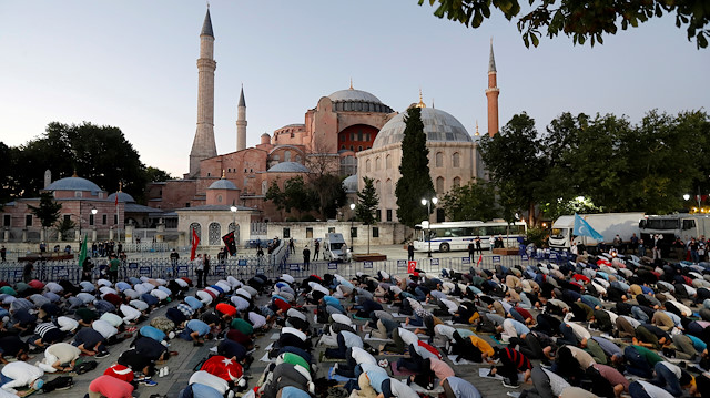 Muslims gather for evening prayers in front of the Hagia Sophia or Ayasofya, after a court decision that paves the way for it to be converted from a museum back into a mosque, in Istanbul, Turkey, July 10, 2020.