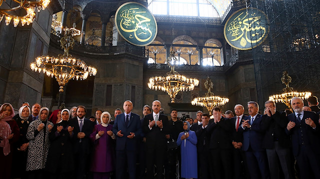 Turkish President Tayyip Erdoğan prays during the opening ceremony of the Yeditepe Biennial at the Hagia Sophia or Ayasofya Museum in Istanbul, Turkey, March 31, 2018.