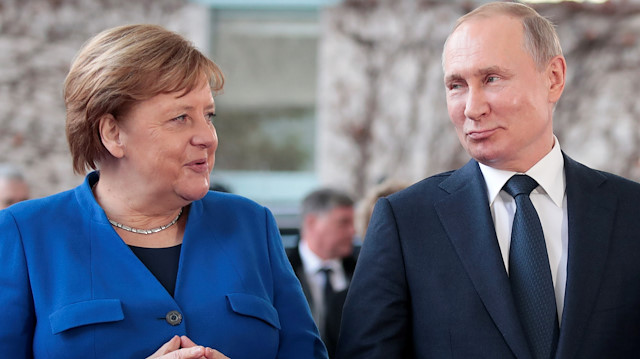 File photo: German Chancellor Angela Merkel and Russian President Vladimir Putin