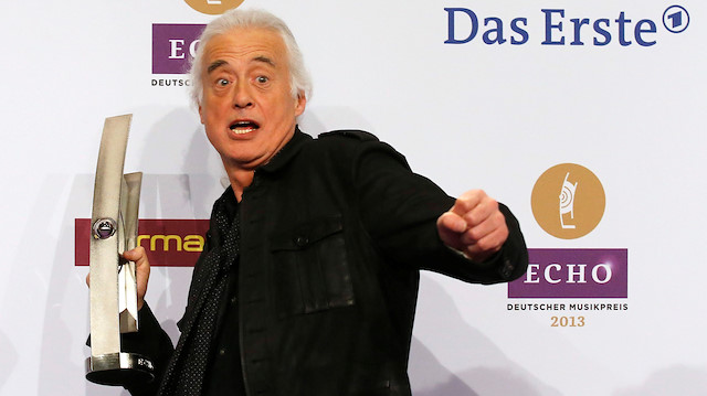 Jimmy Page of the band Led Zeppelin poses with his award during the Echo Music Awards ceremony in Berlin March 21, 2013.