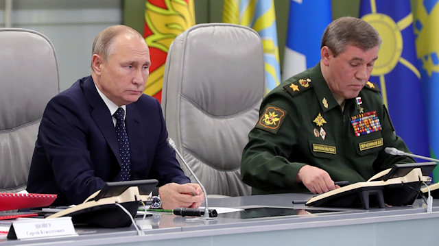 Russia's President Vladimir Putin (L) visits the National Defence Control Centre (NDCC) to oversee the test of a new Russian hypersonic missile system called Avangard, which can carry nuclear and conventional warheads, with Chief of the General Staff of Russian Armed Forces Valery Gerasimov seen nearby, in Moscow, Russia December 26, 2018. Sputnik/Mikhail Klimentyev/Kremlin via REUTERS 