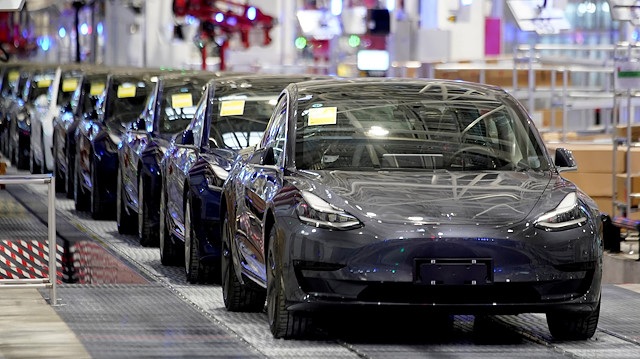 FILE PHOTO: Tesla China-made Model 3 vehicles are seen during a delivery event at its factory in Shanghai, China January 7, 2020. 