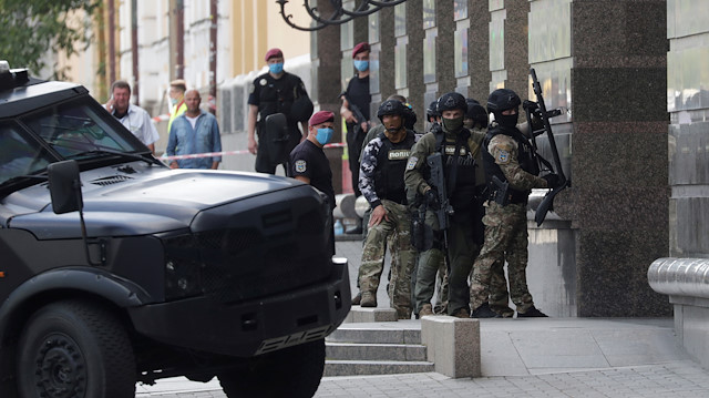 Members of a Ukrainian special forces unit are seen outside a building where an unidentified man reportedly threatens to blow up a bomb in a bank branch, in Kyiv, Ukraine August 3, 2020