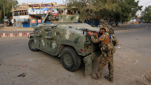Afghan security forces keep watch near the site of an attack on a jail compound in Jalalabad, Afghanistan, August 3, 