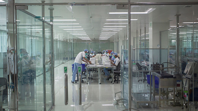 Staff are seen in the COVID-19 vaccine production facility area at the Bio Farma office amid the coronavirus pandemic in Bandung, West Java province, Indonesia August 4, 2020.