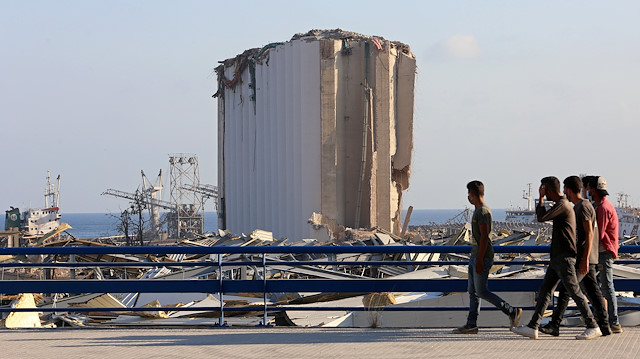 People walk near the site of Tuesday's blast in Beirut's port area, Lebanon August 6, 2020.
