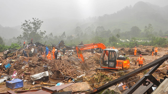 Rescue workers look for survivors at the site of a landslide during heavy rains in Idukki, Kerala, India, August 7, 2020.
