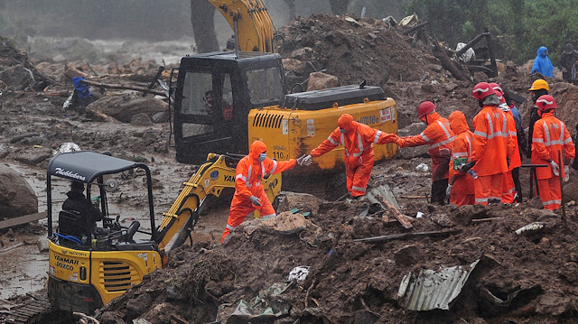 Rescue workers look for survivors at the site of a landslide during heavy rains in Idukki, Kerala, India, August 9, 2020.