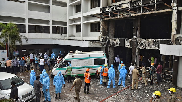 Rescue workers look for survivors after a fire broke out in a hotel that was being used as a coronavirus disease (COVID-19) facility in Vijayawada, in the southern state of Andhra Pradesh, India, August 9, 2020.