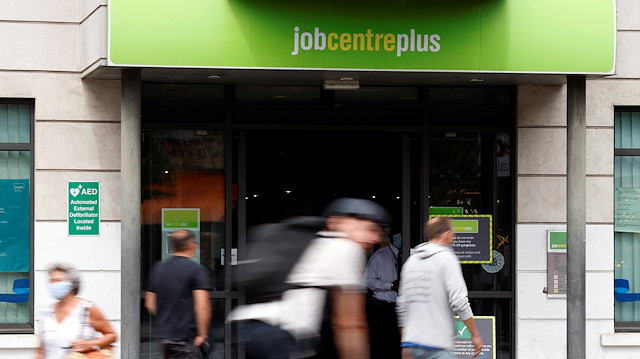 People walk past a branch of Jobcentre Plus, a government run employment support and benefits agency, as the outbreak of the coronavirus disease (COVID-19) continues, in Hackney, London, Britain, August 6, 2020.