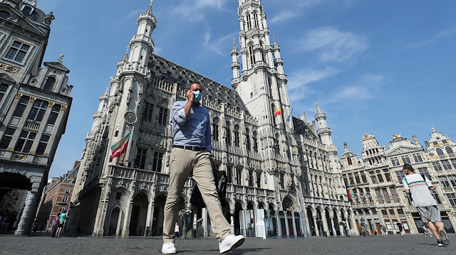 A man wearing a face mask, that became mandatory in Brussels public places, walks at Brussels Grand Place, amid the outbreak of the coronavirus disease (COVID-19), in Brussels, Belgium August 12, 2020.