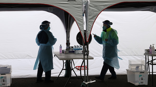 Medical workers are seen at a pop-up testing centre for the coronavirus disease (COVID-19) in Sydney, Australia, August 12, 2020.