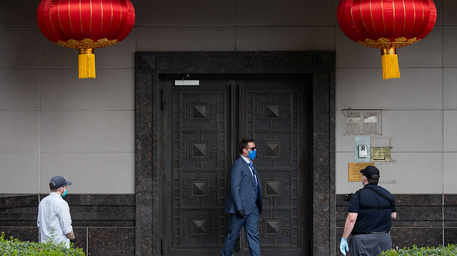 File photo: Plain clothes U.S. security officials surround the entrance of China’s Consulate after Chinese employees left the building, in Houston, Texas, U.S., July 24, 2020. REUTERS/Adrees Latif 