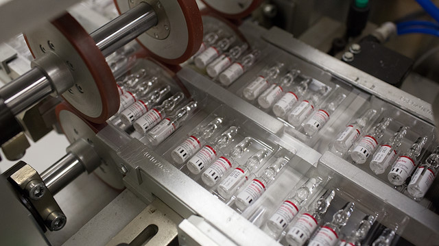 A handout photo shows vials during the production of "Gam-COVID-Vac" vaccine against the coronavirus disease (COVID-19), developed by the Gamaleya National Research Institute of Epidemiology and Microbiology and the Russian Direct Investment Fund (RDIF), at Binnopharm pharmaceutical company in Zelenograd near Moscow, Russia August 7, 2020. Picture taken August 7, 2020. The Russian Direct Investment Fund (RDIF)/Andrey Rudakov/Handout via REUTERS ATTENTION EDITORS - THIS IMAGE WAS PROVIDED BY A THIRD PARTY. NO RESALES. NO ARCHIVES. MANDATORY CREDIT.

