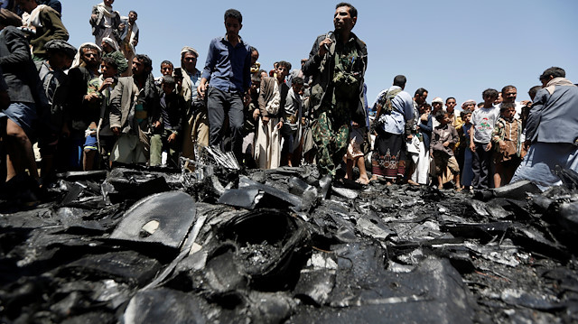 People gather at the site of the wreckage of a drone aircraft which the Houthi rebels said they have downed in Sanaa, Yemen October 1, 2017. REUTERS/Khaled Abdullah

