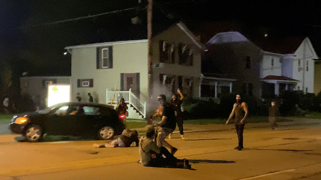 A man is being shot in his arm during a protest following the police shooting of Jacob Blake, a Black man, in Kenosha, Wisconsin, U.S., August 25, 2020.