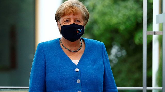 German Chancellor Angela Merkel wearing a face mask arrives for her annual summer news conference during the outbreak of the coronavirus disease (COVID-19) in Berlin, Germany, August 28, 2020. REUTERS/Michele Tantussi/Pool  
