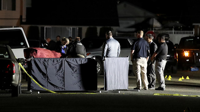 Investigators move the body at Tanglewilde Terrace, where law enforcement officers shot a man reported to be Michael Forest Reinoehl, in Lacey, Washington, U.S. September 4, 2020