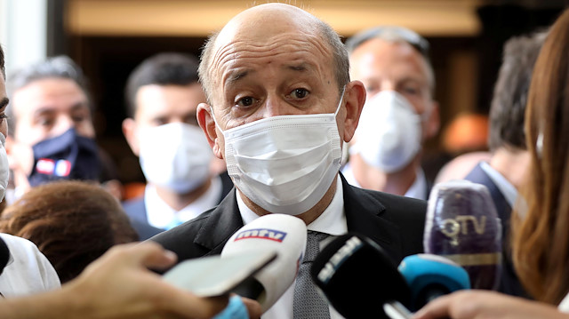 French Foreign Affairs Minister Jean-Yves Le Drian wears a face mask to prevent the spread of the coronavirus disease (COVID-19) as he talks to the media at a school in Mechref, Lebanon July 24, 2020. REUTERS/Mohamed Azakir

