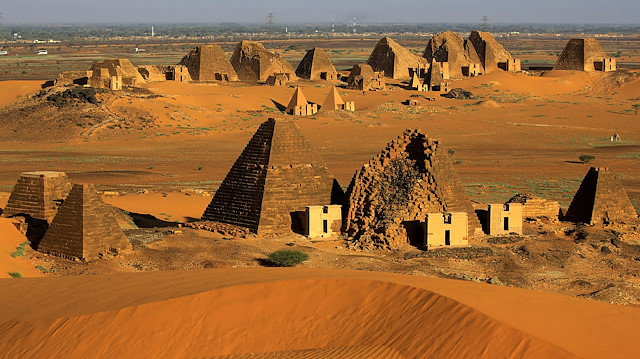 FILE PHOTO: Creeping desert sands surround the Royal Cemeteries of Meroe Pyramids in Begrawiya at River Nile State, Sudan November 10, 2019