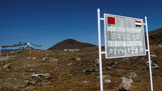 A signboard is seen from the Indian side of the Indo-China border at Bumla, in the northeastern Indian state of Arunachal Pradesh, November 11, 2009.