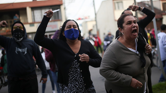 People protest outside a police station after a man, who was detained for violating social distancing rules, died from being repeatedly shocked with a stun gun by officers, according to authorities, in Bogota, Colombia September 9, 2020.