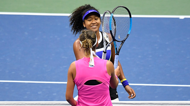 Sep 12 2020; Flushing Meadows, New York, USA; Naomi Osaka of Japan (top) touches racquets with Victoria Azarenka of Belarus (bottom) after their match in the women's singles final on day thirteen of the 2020 U.S. Open tennis tournament at USTA Billie Jean King National Tennis Center