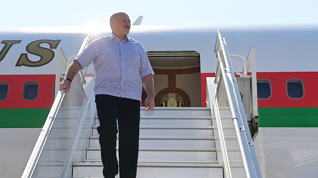 Belarusian President Alexander Lukashenko walks out of a plane upon his arrival at an airport in Sochi, Russia September 14, 2020