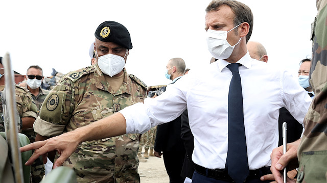 FILE PHOTO: French President Emmanuel Macron meets members of the military mobilised for the reconstruction of the port of Beirut, in Beirut, Lebanon September 1, 2020. Stephane Lemouton/Pool via REUTERS/File Photo

