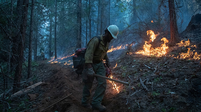 A firefighter from Las Vegas takes part in a firing operation near the Obenchain Fire in Butte Falls, Oregon, U.S., September 15, 2020. 
