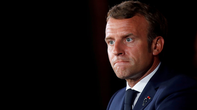 French President Emmanuel Macron looks