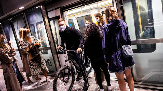People wearing protective masks ride the metro, amid the coronavirus disease (COVID-19) outbreak, in Copenhagen, Denmark August 22, 2020