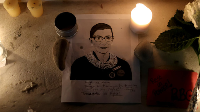 Candles and an image of late U.S. Supreme Court Justice Ruth Bader Ginsburg are seen as people gather in front of the U.S. Supreme Court following her death, in Washington, U.S., September 19, 2020